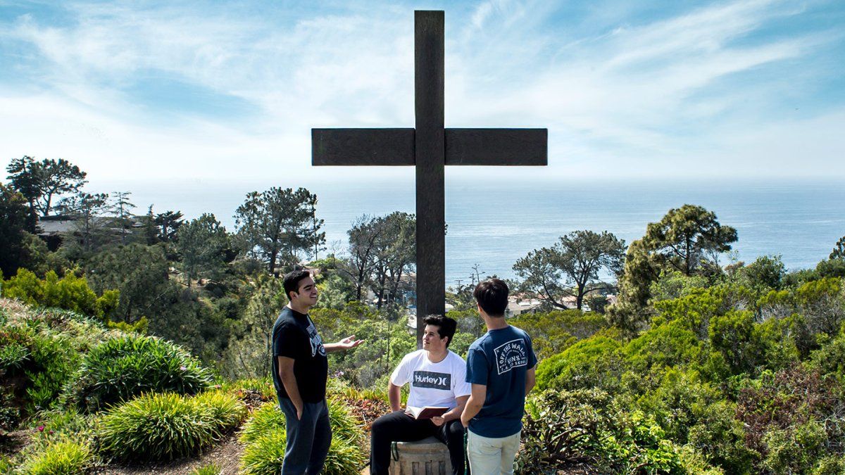 students by the cross