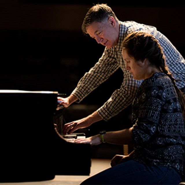 Sarah Victor gets piano lessons from Professor Victor Labenske