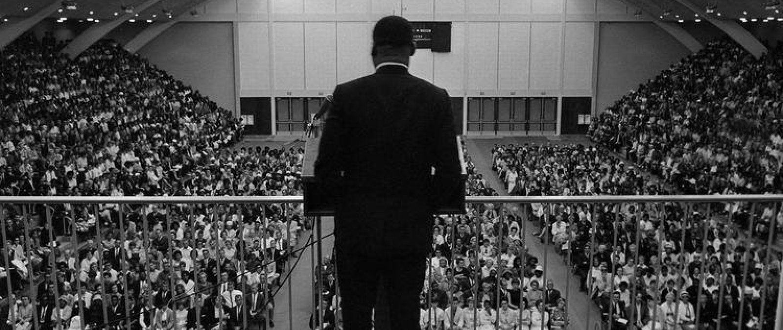 Martin Luther King Jr speaks to a large crowd gathered in Golden Gymnasium.