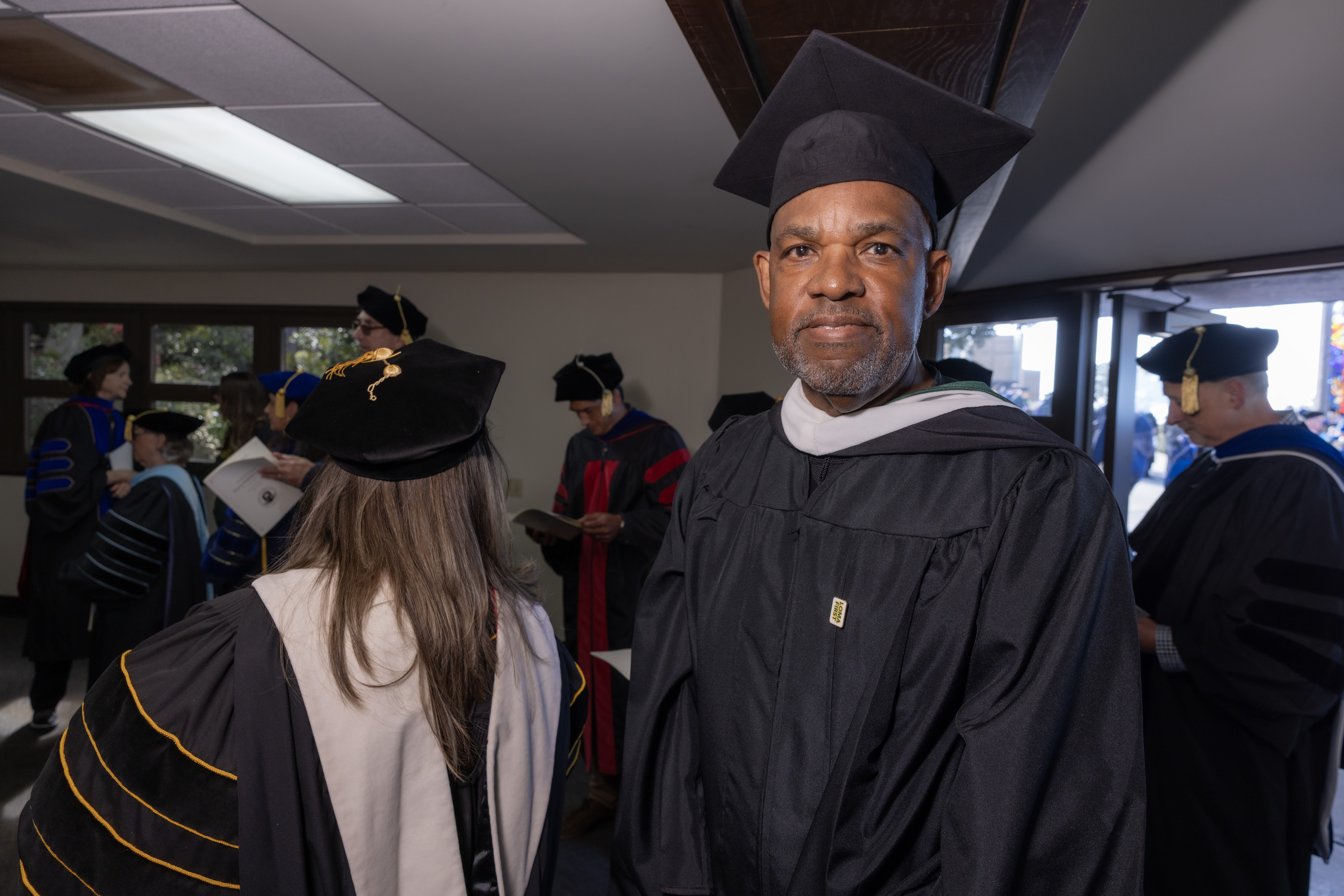 Glen Laster wearing PLNU commencement attire