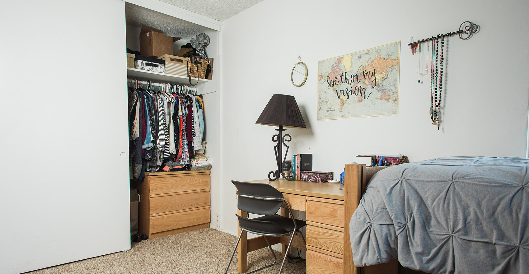 A neatly decorated and organized room in the Colony Apartments