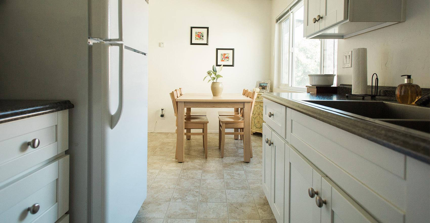 A kitchen and dining area in the Colony Apartments.