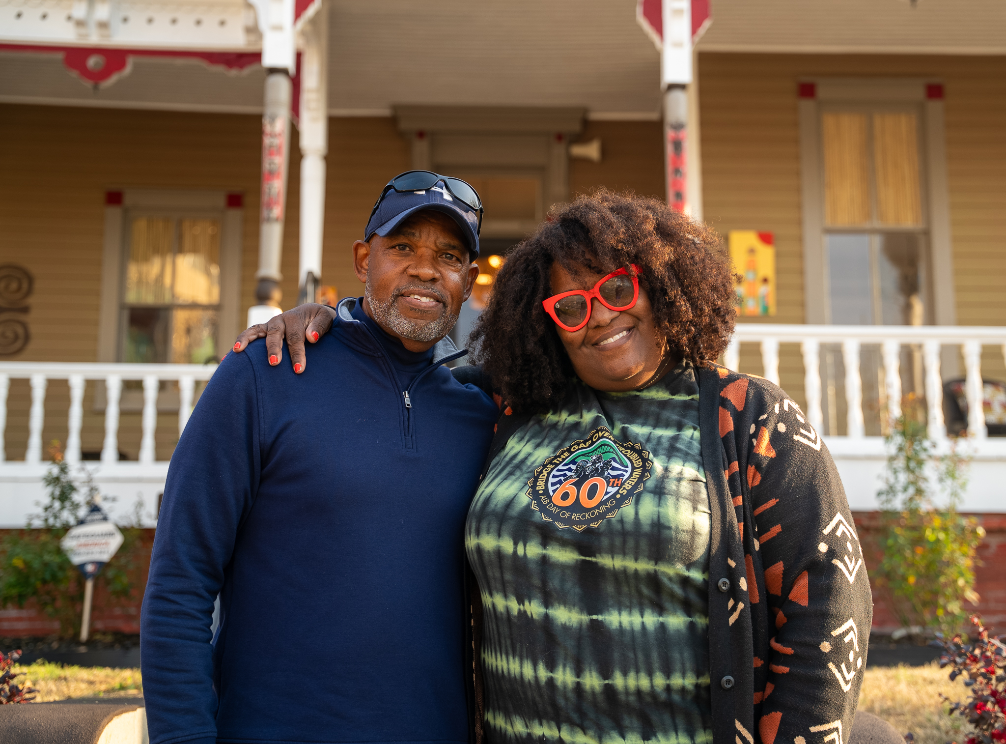 Glen Laster and a friend pose for a photo outside