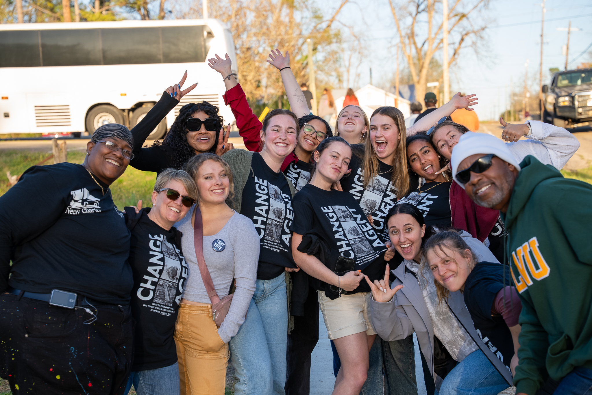 A large group smiles for a photo during the Civil Rights Pilgrimage trip