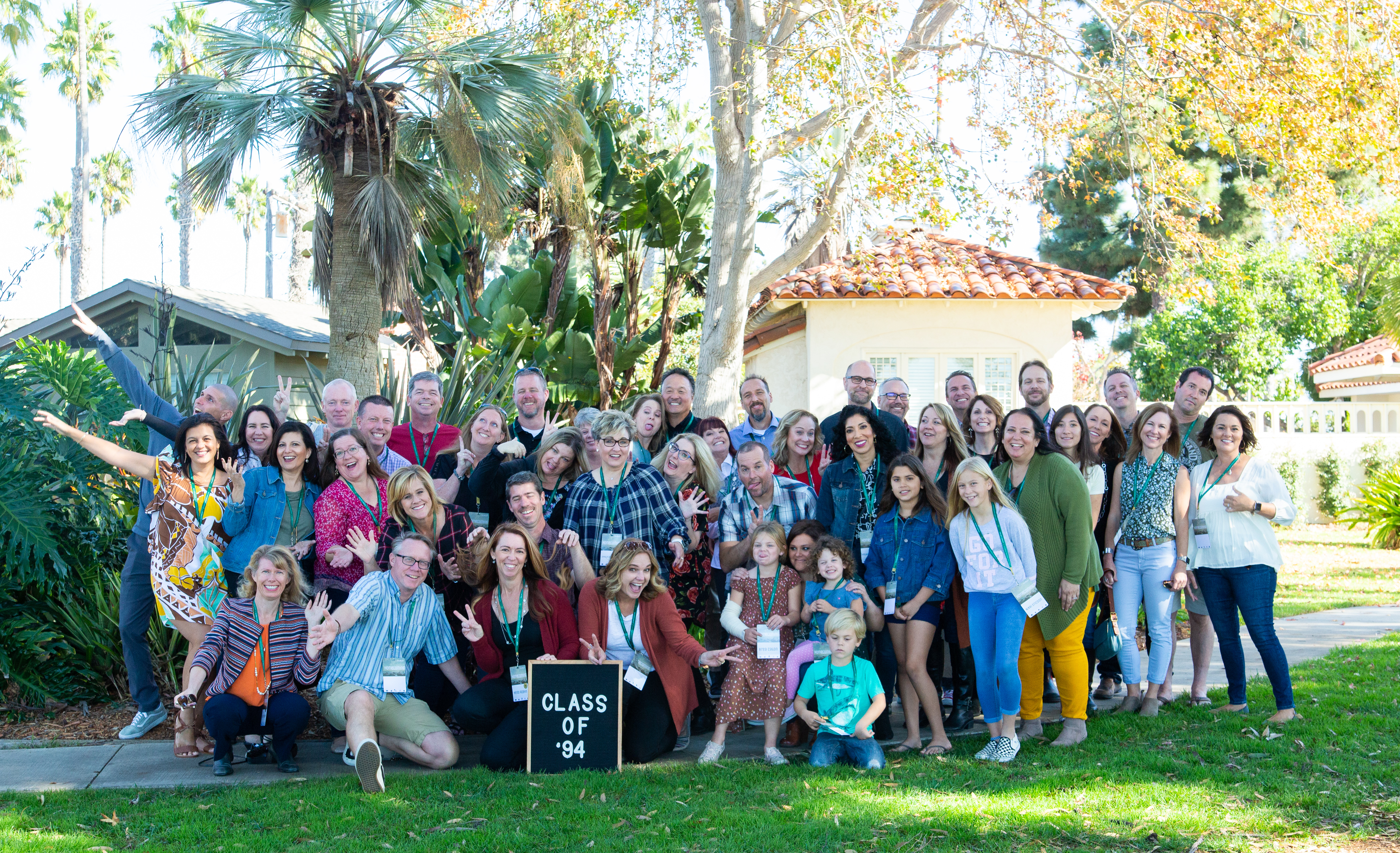 A group of people taking a picture outside
