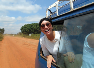 Woman Sticking Head Out of Window