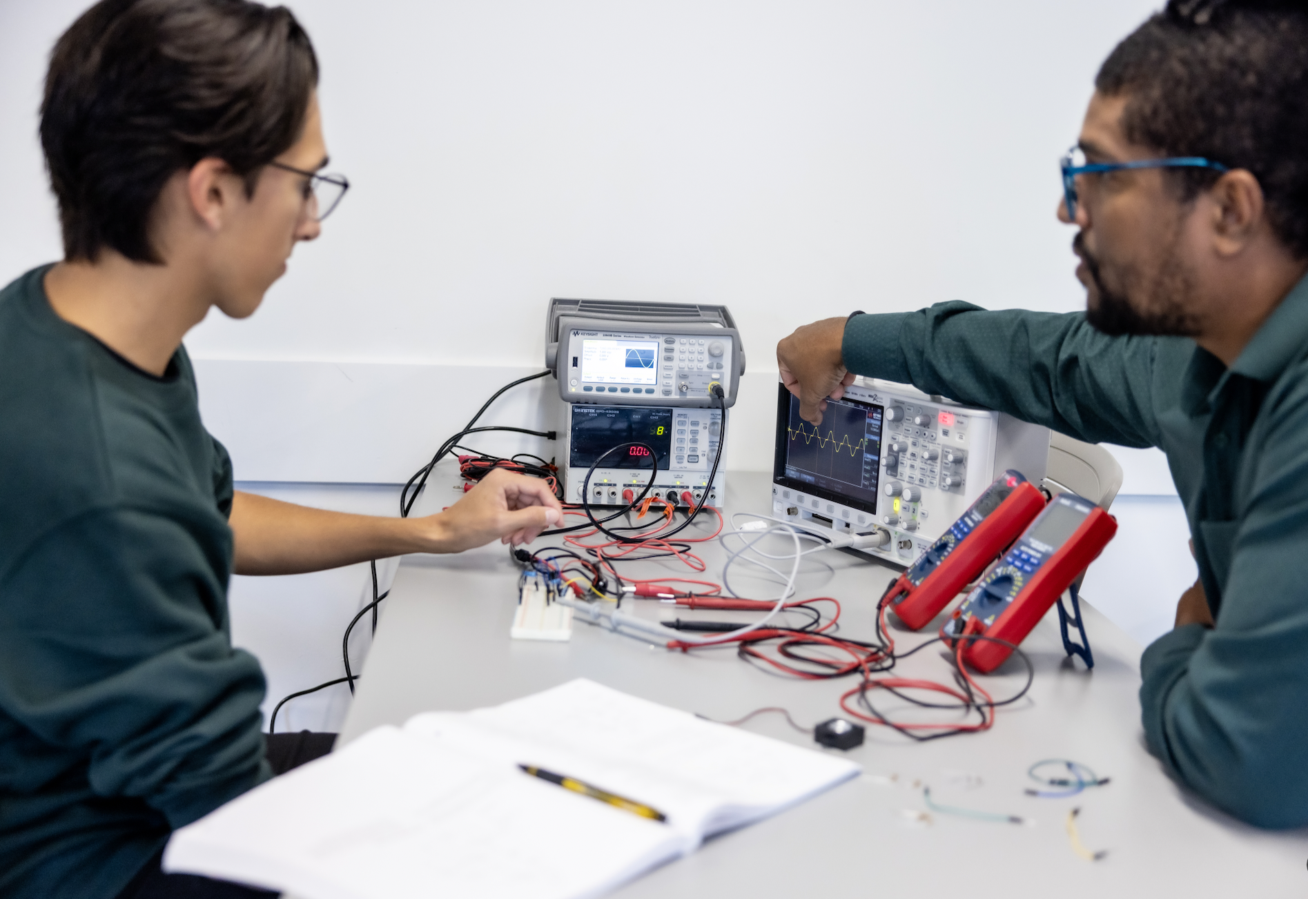 PLNU students work together on technical project in the engineering lab on the university campus.
