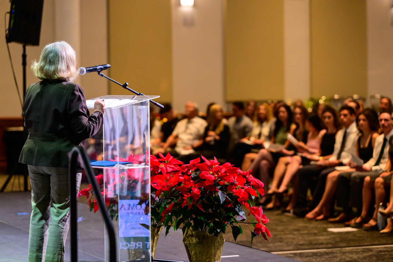 DR. Dana Sayre-Stanhope Addresses Students on Stage