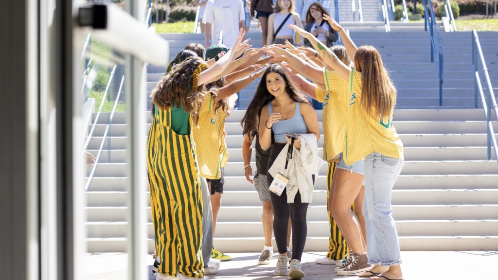 Students welcoming each other on campus