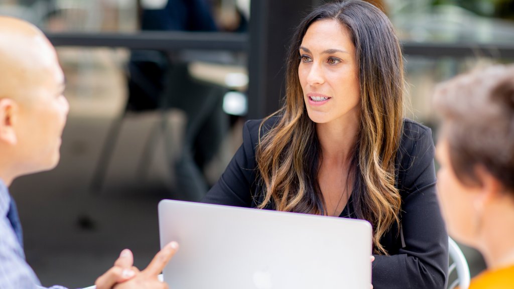Female graduate student in small group