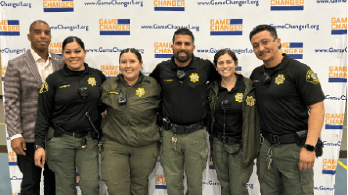 Police officers gather for a photo at a GameChangers event