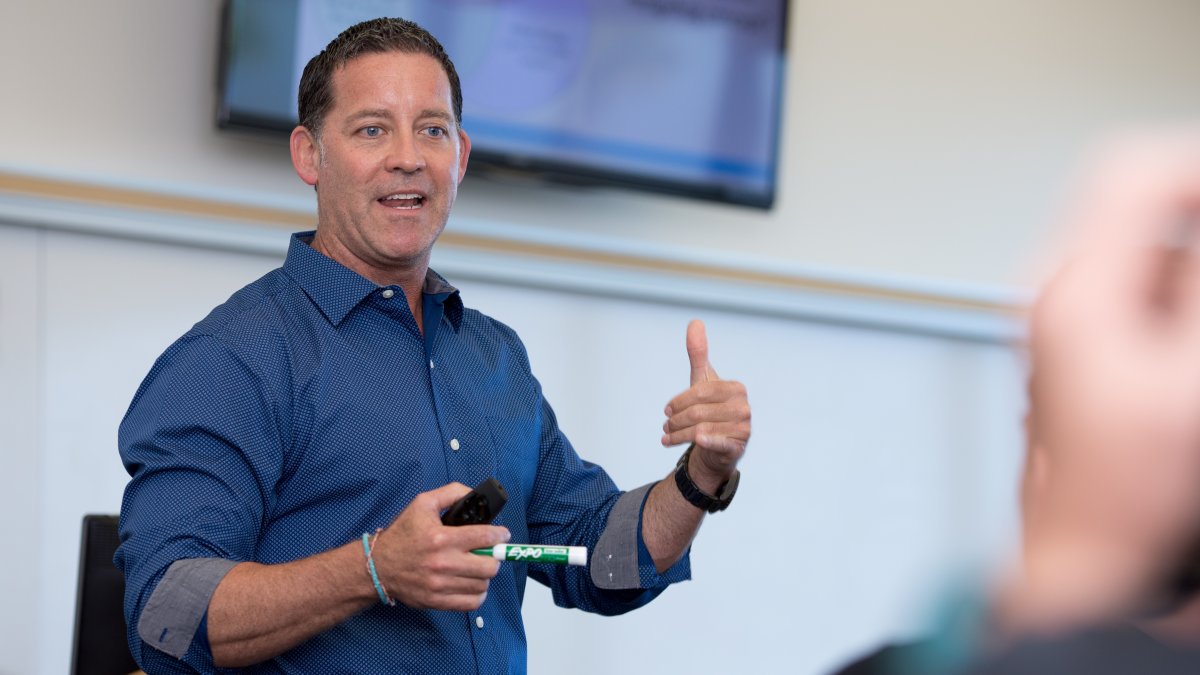 Randal Schober teaches in a classroom