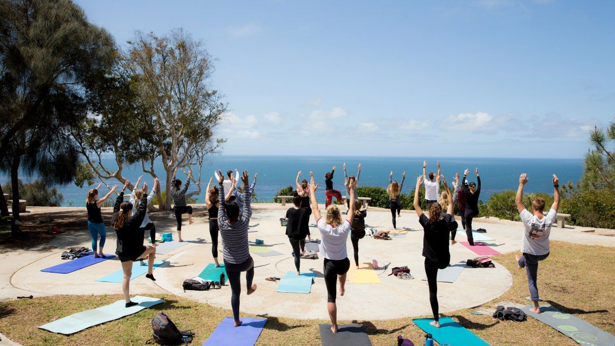 Yoga class overlooking ocean on campus.