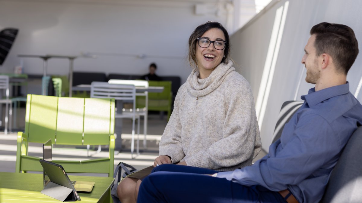 2 Students conversing outside 