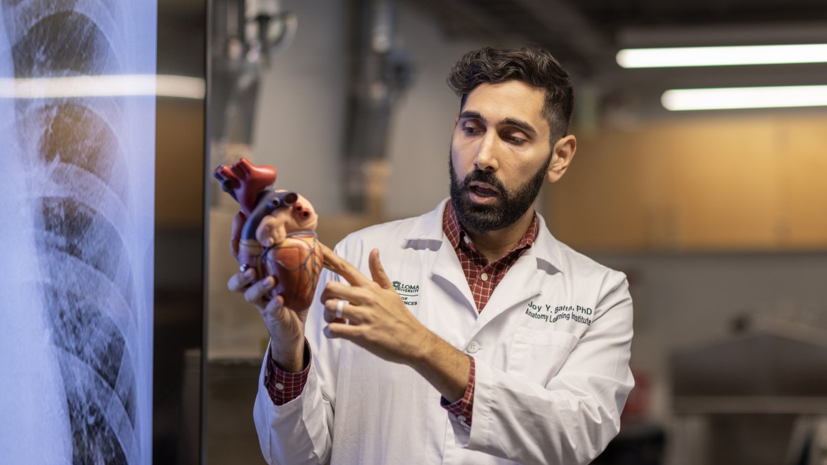 Associate Professor and Director Joy Y. Balta, PhD. gives anatomy lecture to students in laboratory.