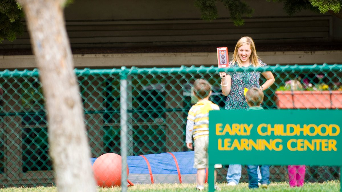 A woman with kids at the early childhood learning center