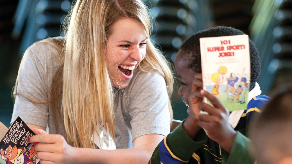 A PLNU student tutors a child through Alima Tutoring Ministry.