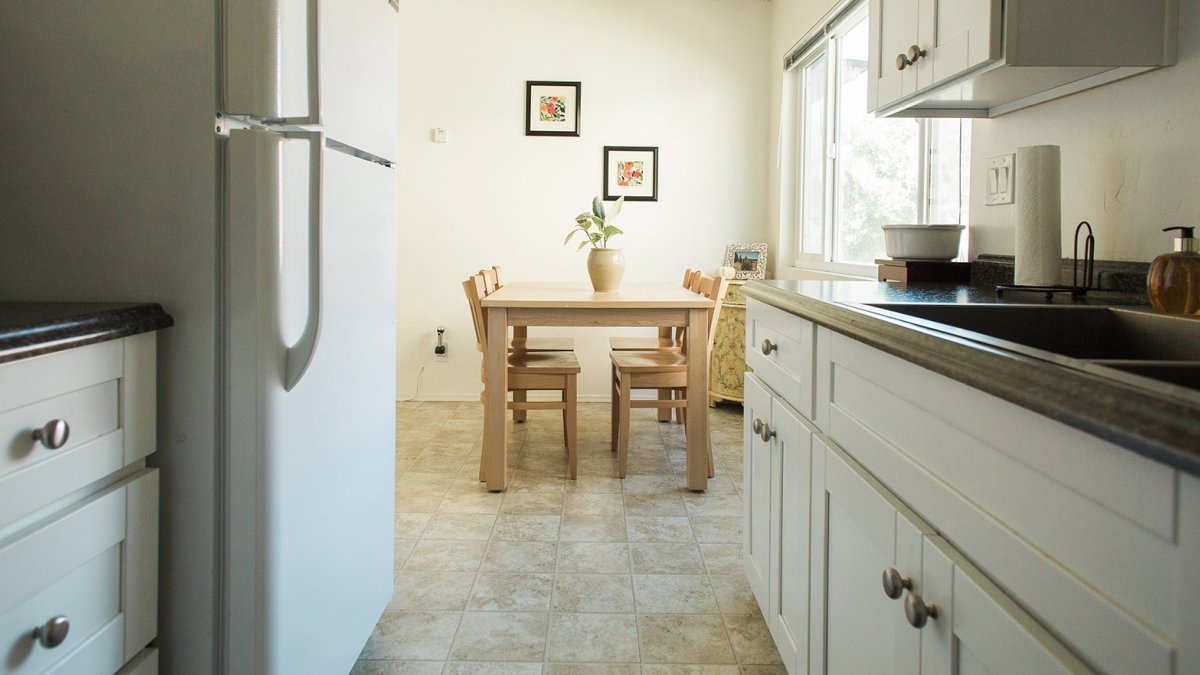 A kitchen and dining area in the Colony Apartments.