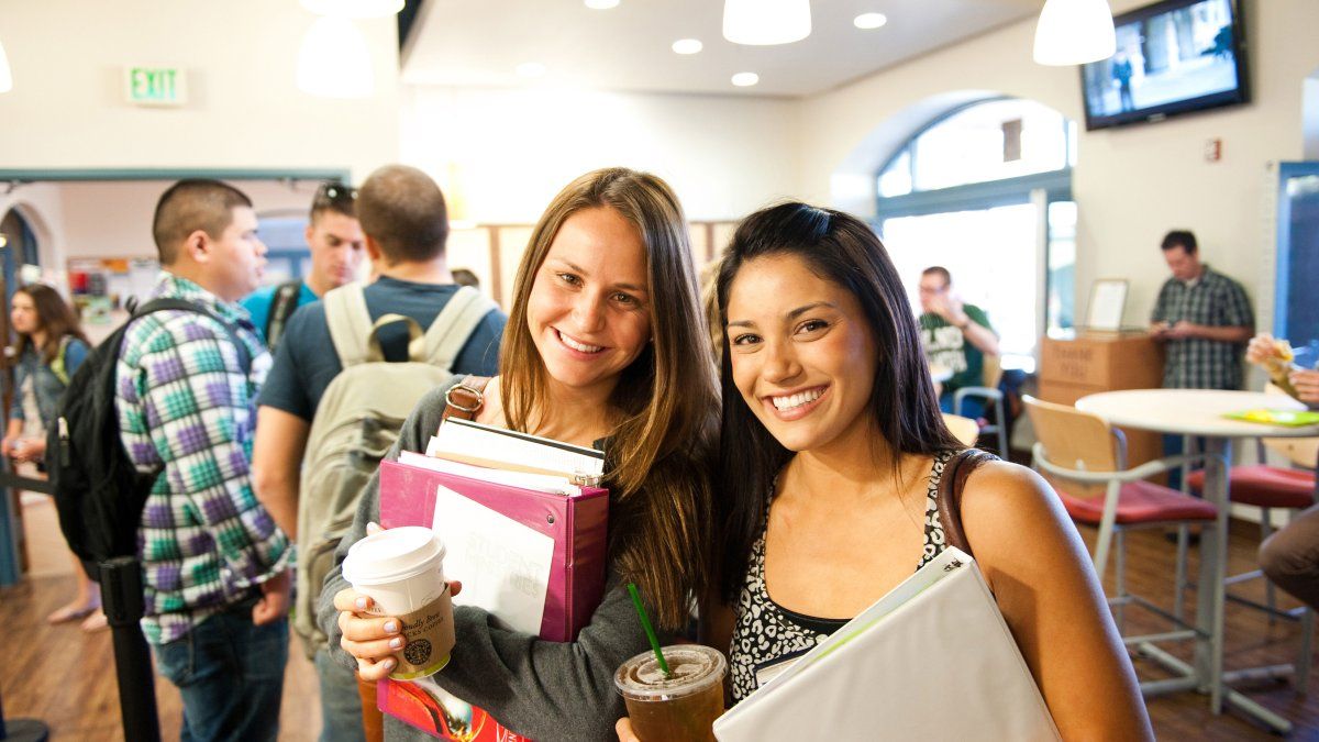 Students drinking coffee at Bobby B's on campus.