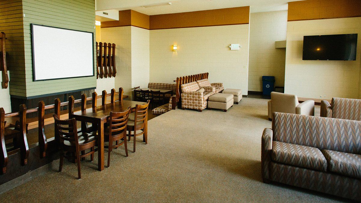 Couches, chairs, and a soft carpeted floor make up the Goodwin Lounge.