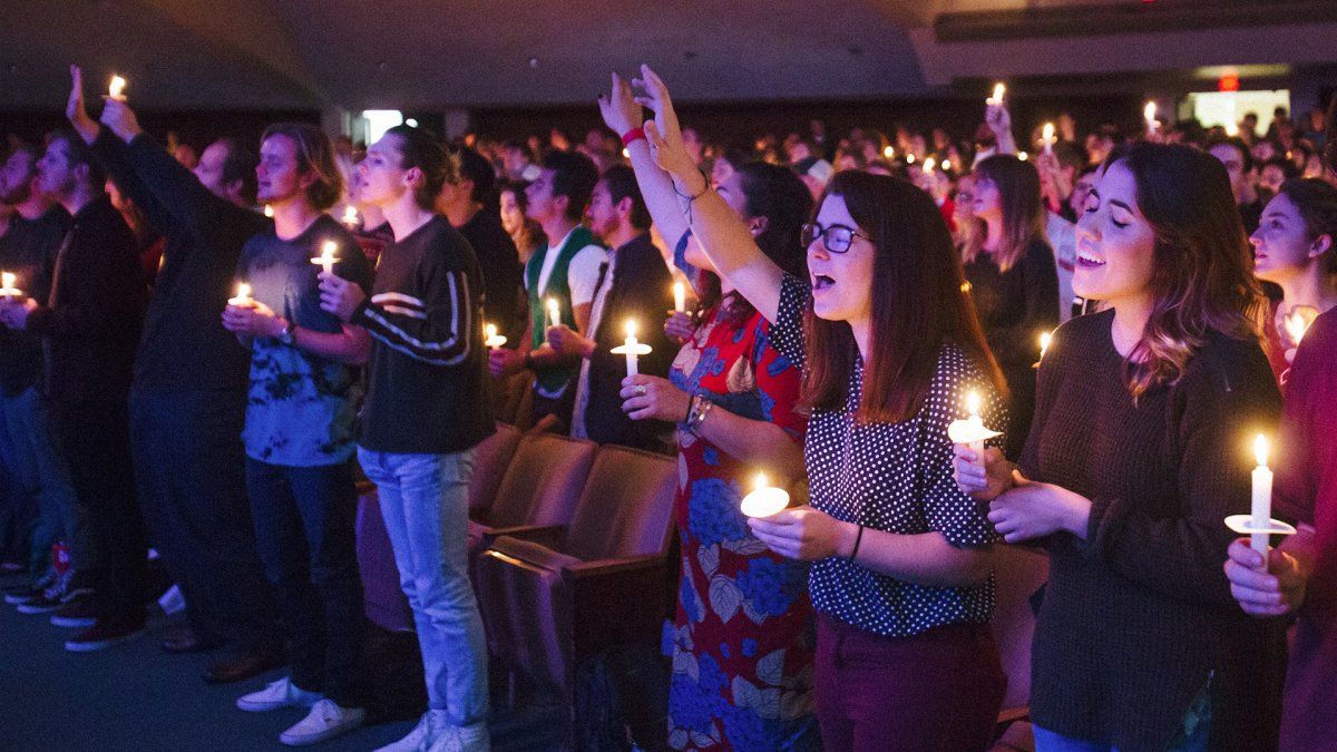 Students worship during a candlelight service in Brown Chapel.
