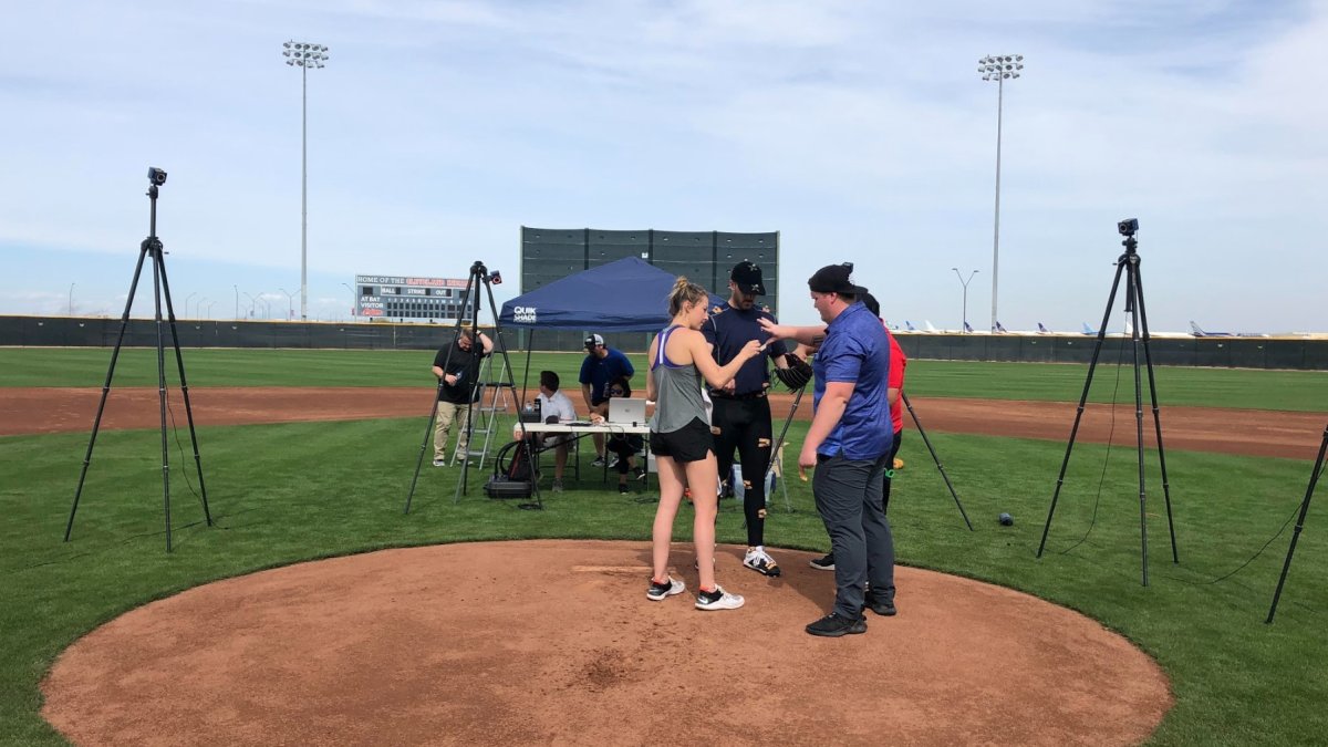 People on the baseball mound 