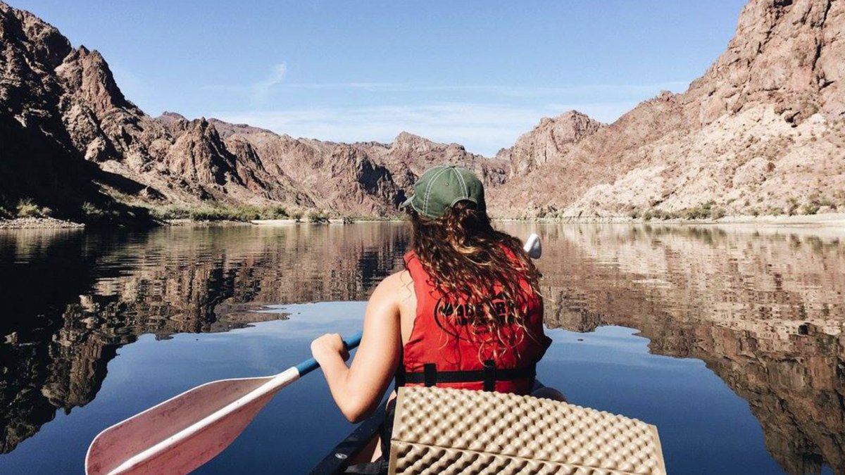 A student canoes up the Colorado River during a fall break trip.