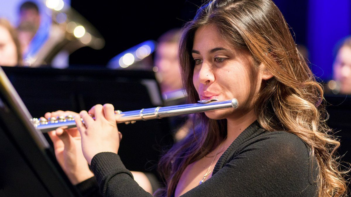 A student plays the flute