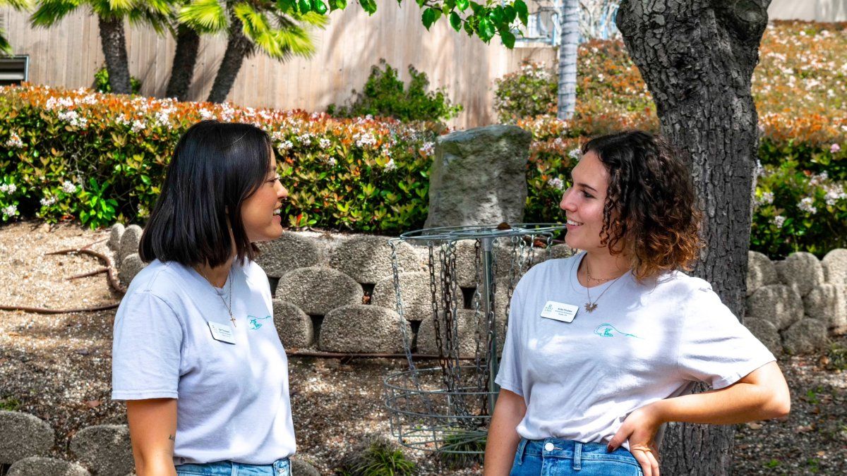 Two Student Admissions Workers Talking