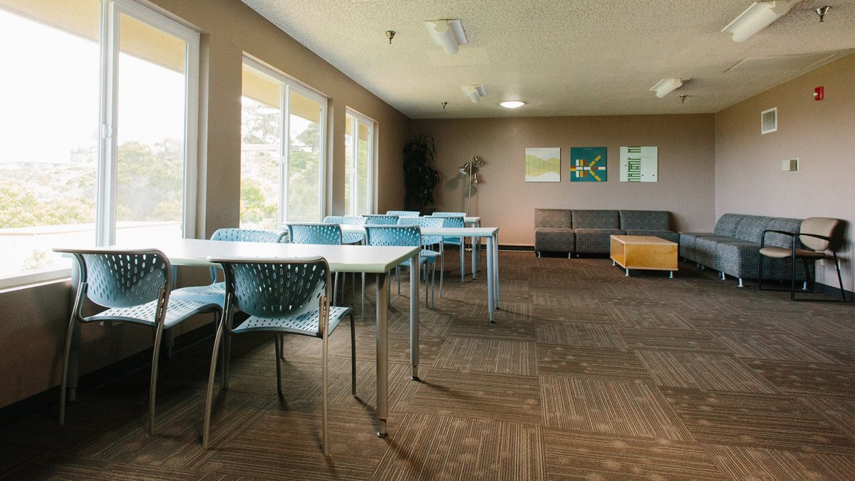 A large study room with chairs and desks.