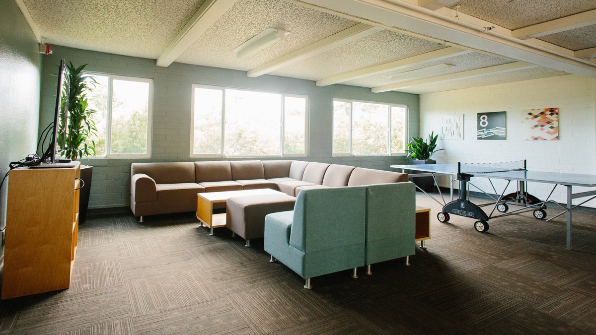 Large sofas and a ping pong table make up the Wiley downstairs lounge space.