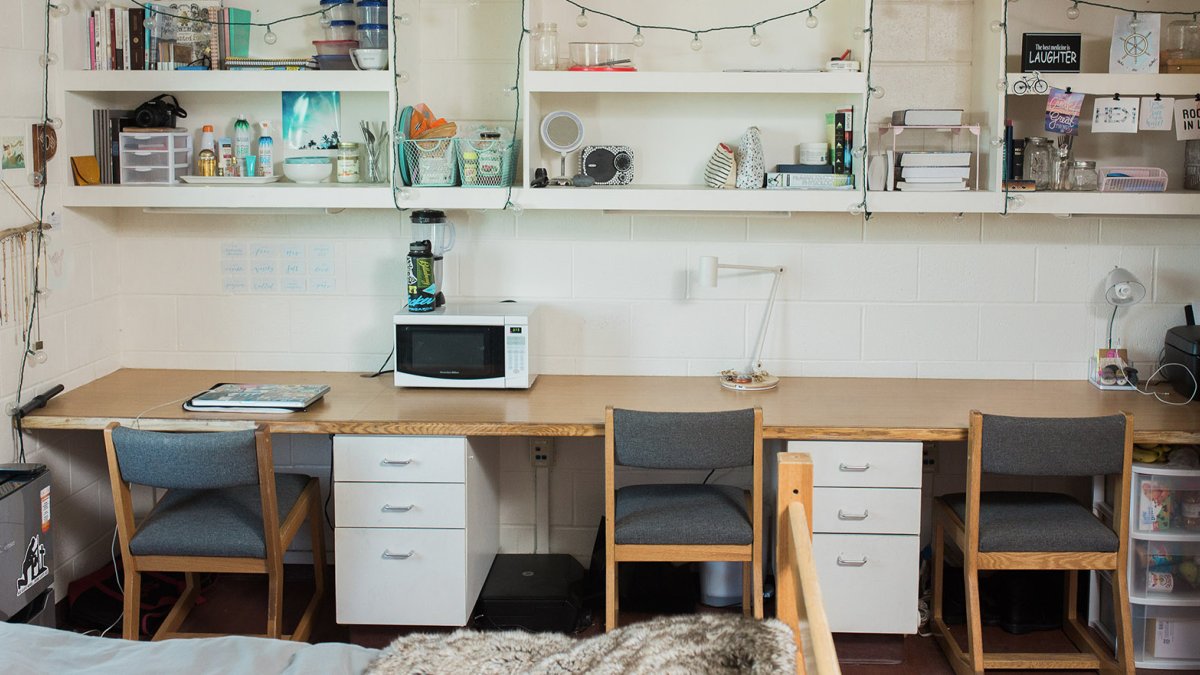 Three desks along a wall in Young Hall.