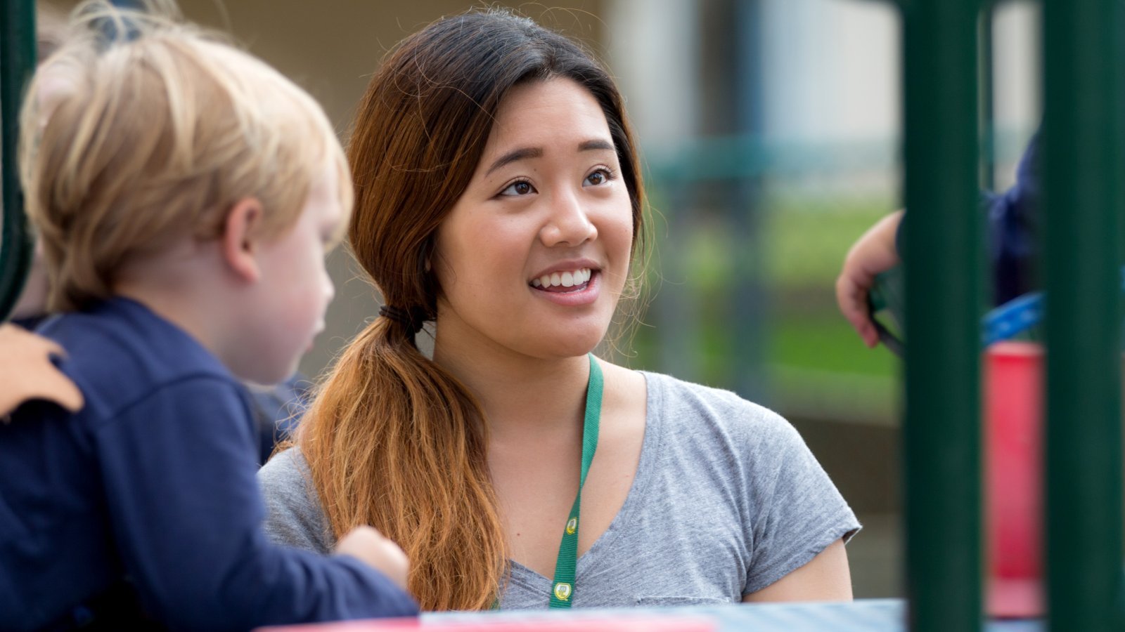 Female student working with Children at the ECLC