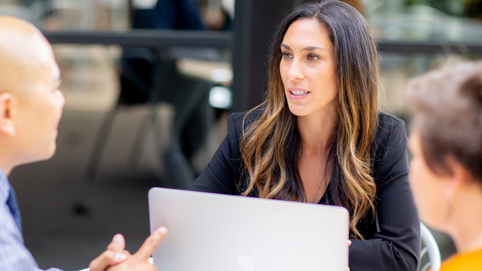 Female graduate student in small group