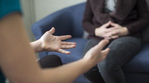 Image of counselor speaking with client. 