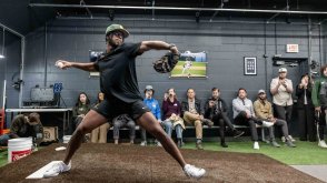 PLNU pitcher steps to throw a pitch at the Biomechanics Lab