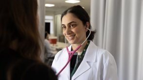 PLNU nursing student performs health examination on volunteer at university's Balboa Campus nursing lab.