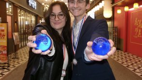 Students holding debate awards