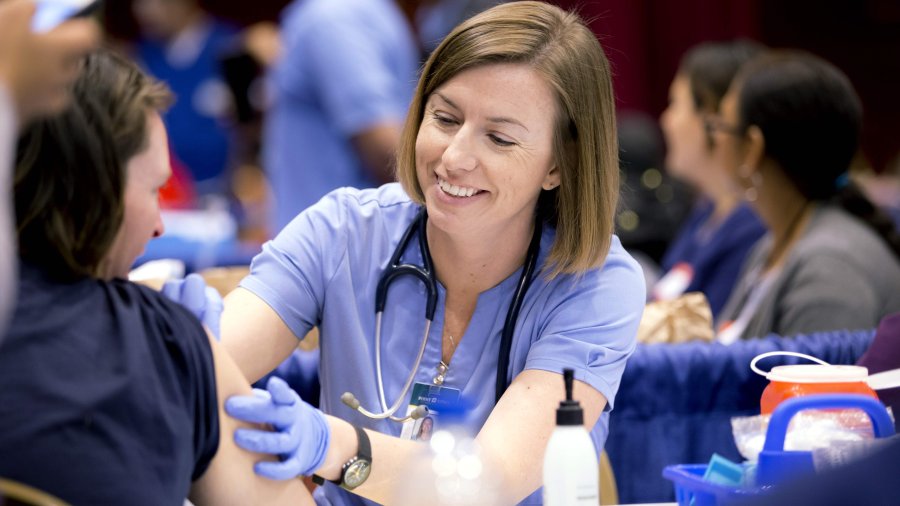 Nurse helping patient 