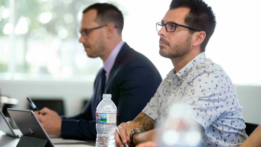 An PLNU adult students sits in class and learns.