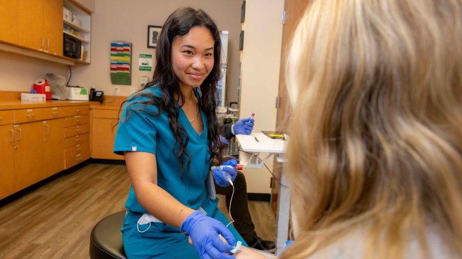 Nursing student takes care of a patient