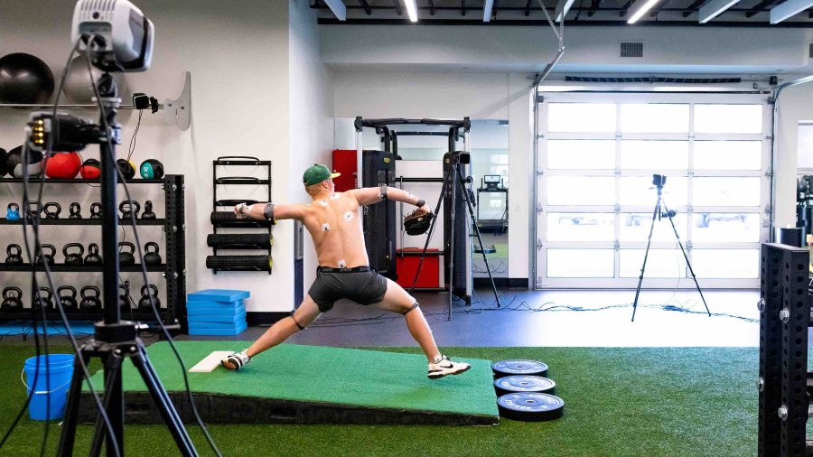 PLNU pitcher throws at the pitching lab