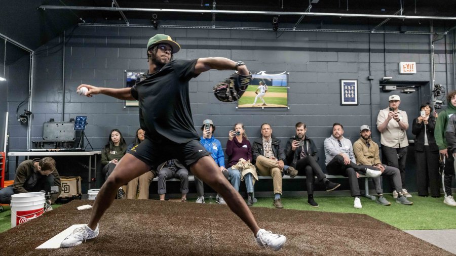 PLNU pitcher steps to throw a pitch at the Biomechanics Lab