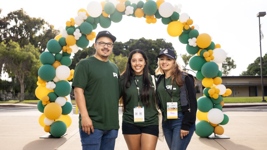 Student poses with her family members during Welcome Week at Point Loma Nazarene University.