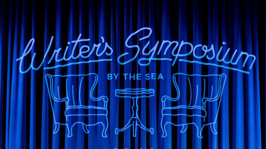 Writer's Symposium image on blue curtains in Crill