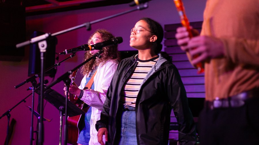 Woman sings on stage