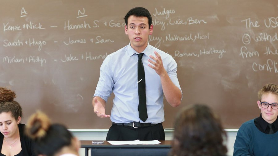 The Speech & Debate team practices in a classroom