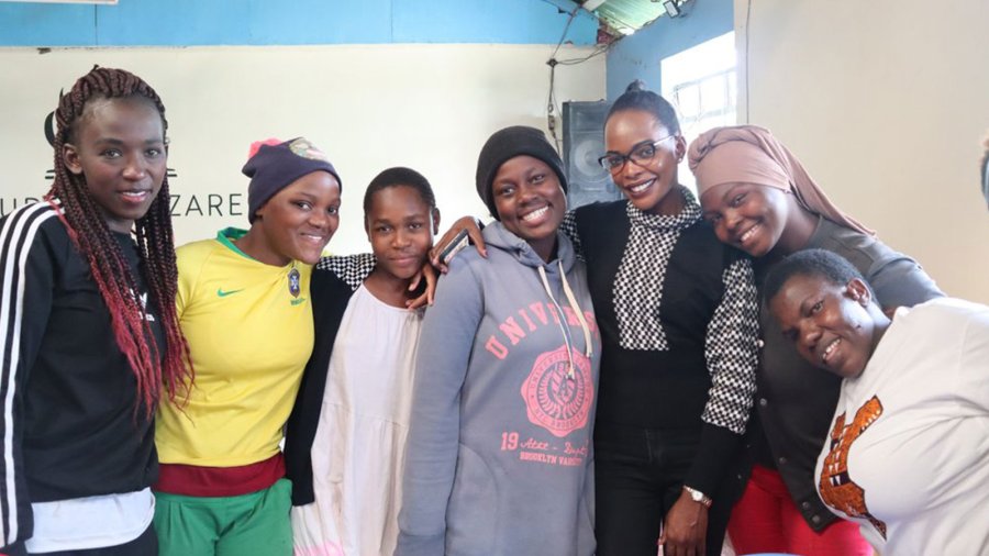 A group of women from Kenya smile for a photo