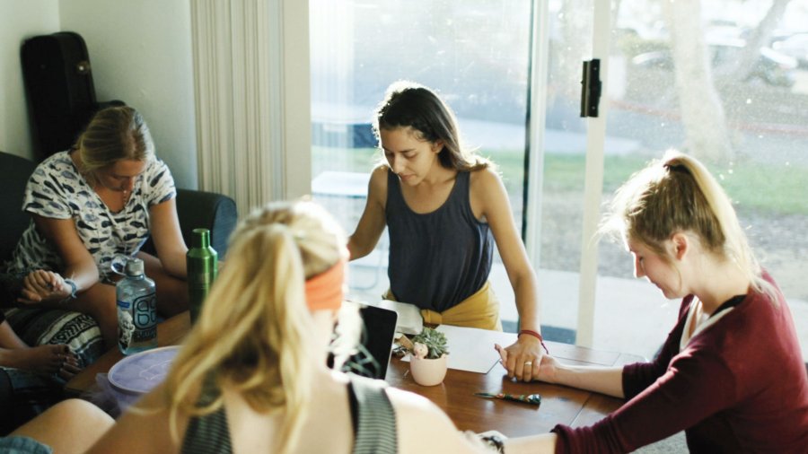 Female students praying at D group