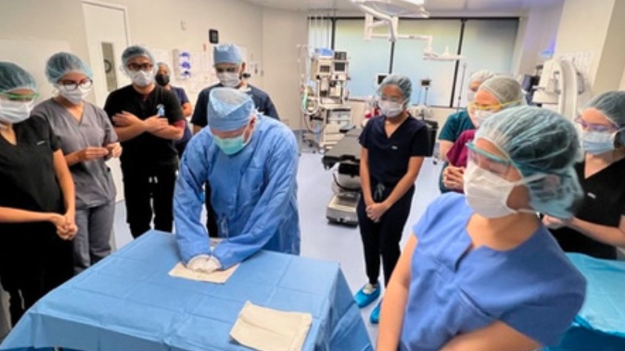 A PA class looks on during a clinical rotation